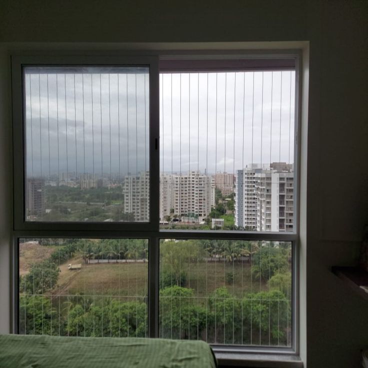 Window invisible grill installation in Chennai by Varahi Enterprises