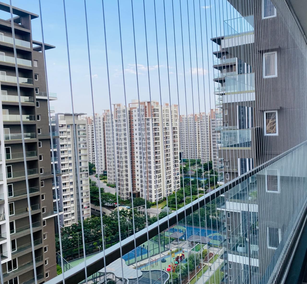 Balcony invisible grill OMR Chennai apartment by Varahi Enterprises