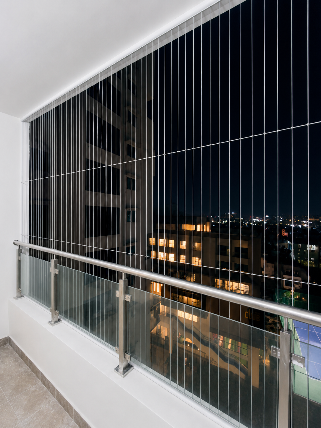 Balcony invisible grill with clear view installed in Adyar Chennai by Varahi Enterprises